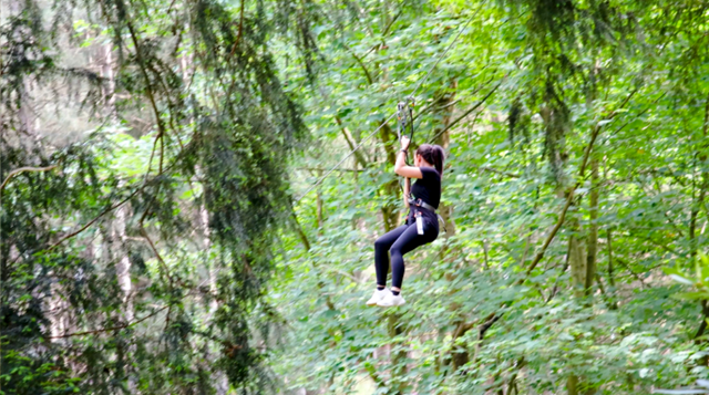 Image of girl on zip line at go ape at woburn safari park in bedfordshire