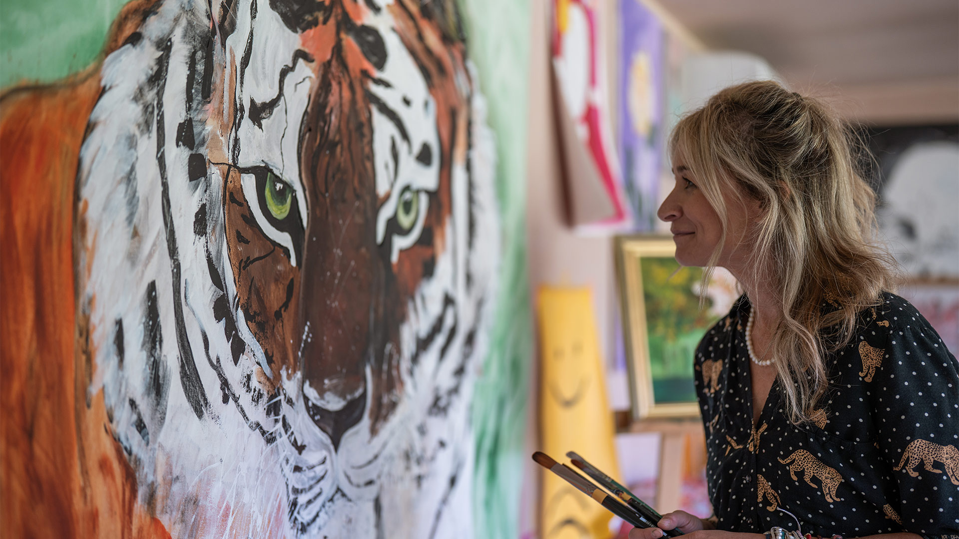 Leah Wood looking at painting of vera